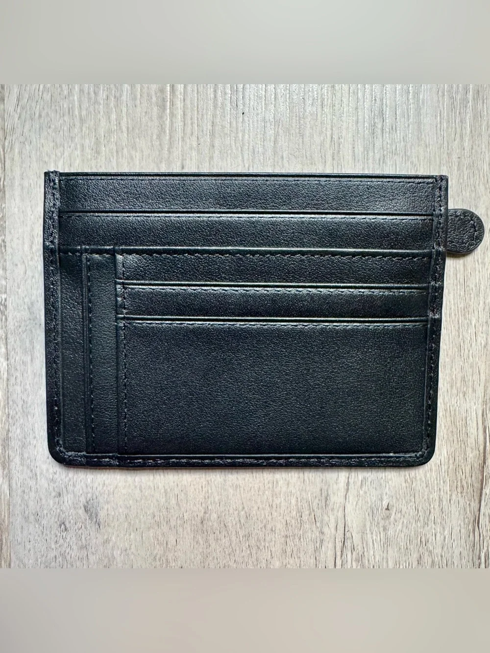 Kinzd minimalist leather card holder by Kinzd, featuring a zippered compartment